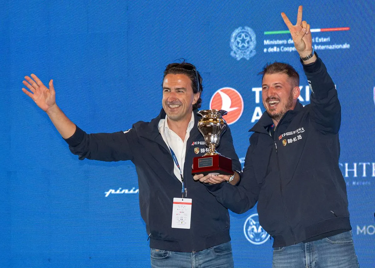 Erick Mahle and his co-driver on stage with the second-place trophy at the 1000 Miglia Experience USA Florida 2026