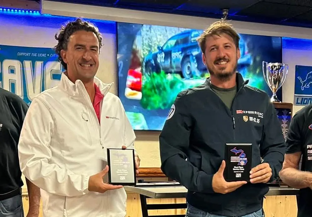 Erick Mahle and his co-driver holding their Novice class awards at Press On Regardless 2026